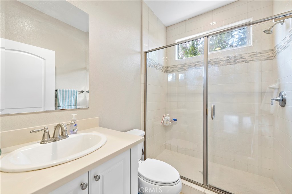 108 Fairgrove Irvine, CA 92618 - Photo 26 of 40 a bathroom with a sink toilet and shower