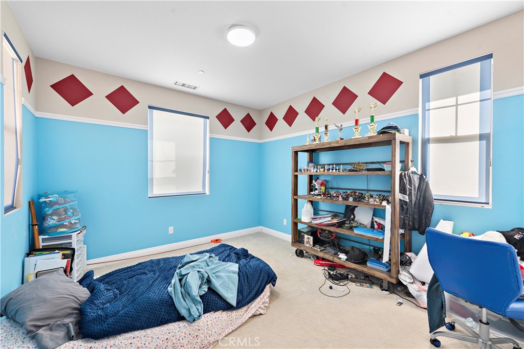 108 Fairgrove Irvine, CA 92618 - Photo 32 of 40 a bedroom with a bed and a chair