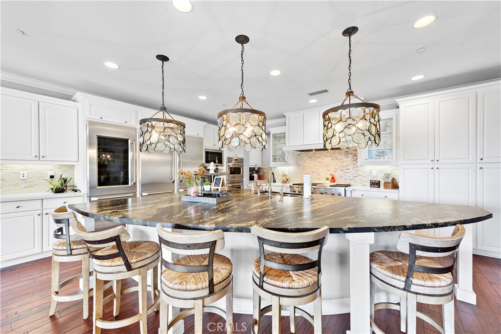 108 Fairgrove Irvine, CA 92618 - Photo 4 of 40 a kitchen with a dining table and chairs