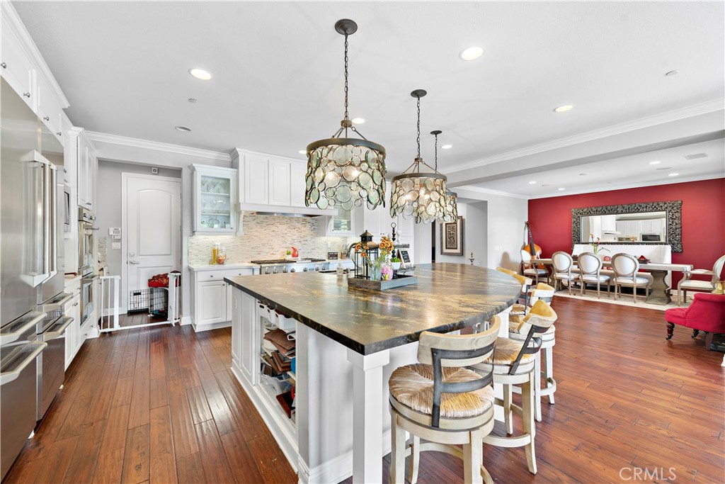 108 Fairgrove Irvine, CA 92618 - Photo 8 of 40 a very nice looking dining room with a large center island wooden floor and furniture