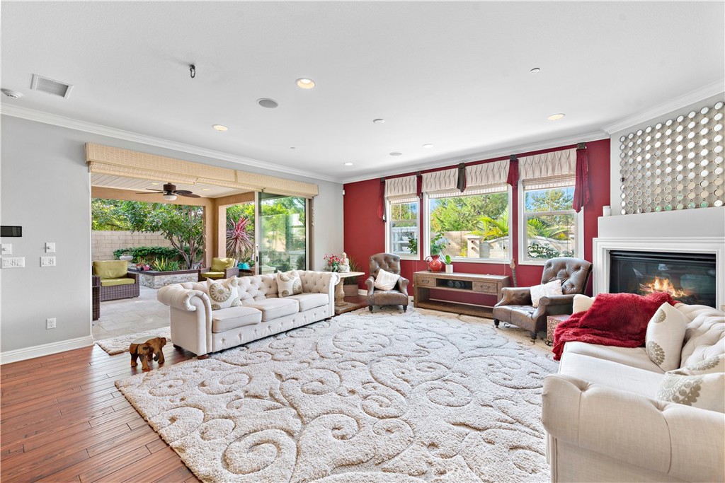 108 Fairgrove Irvine, CA 92618 - Photo 9 of 40 a living room with furniture and large windows