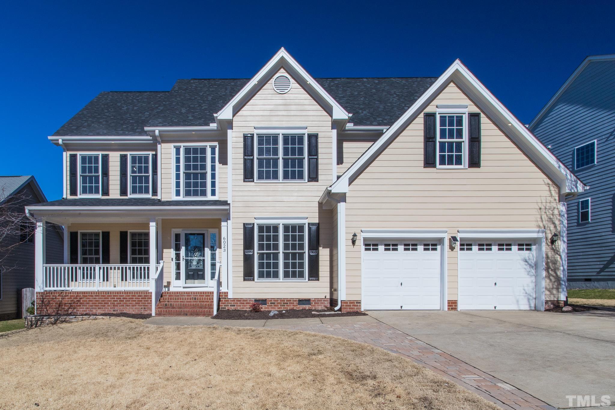 6023 Clapton Drive Wake Forest, NC 27587 - Photo 1 of 35 a front view of a house with a yard