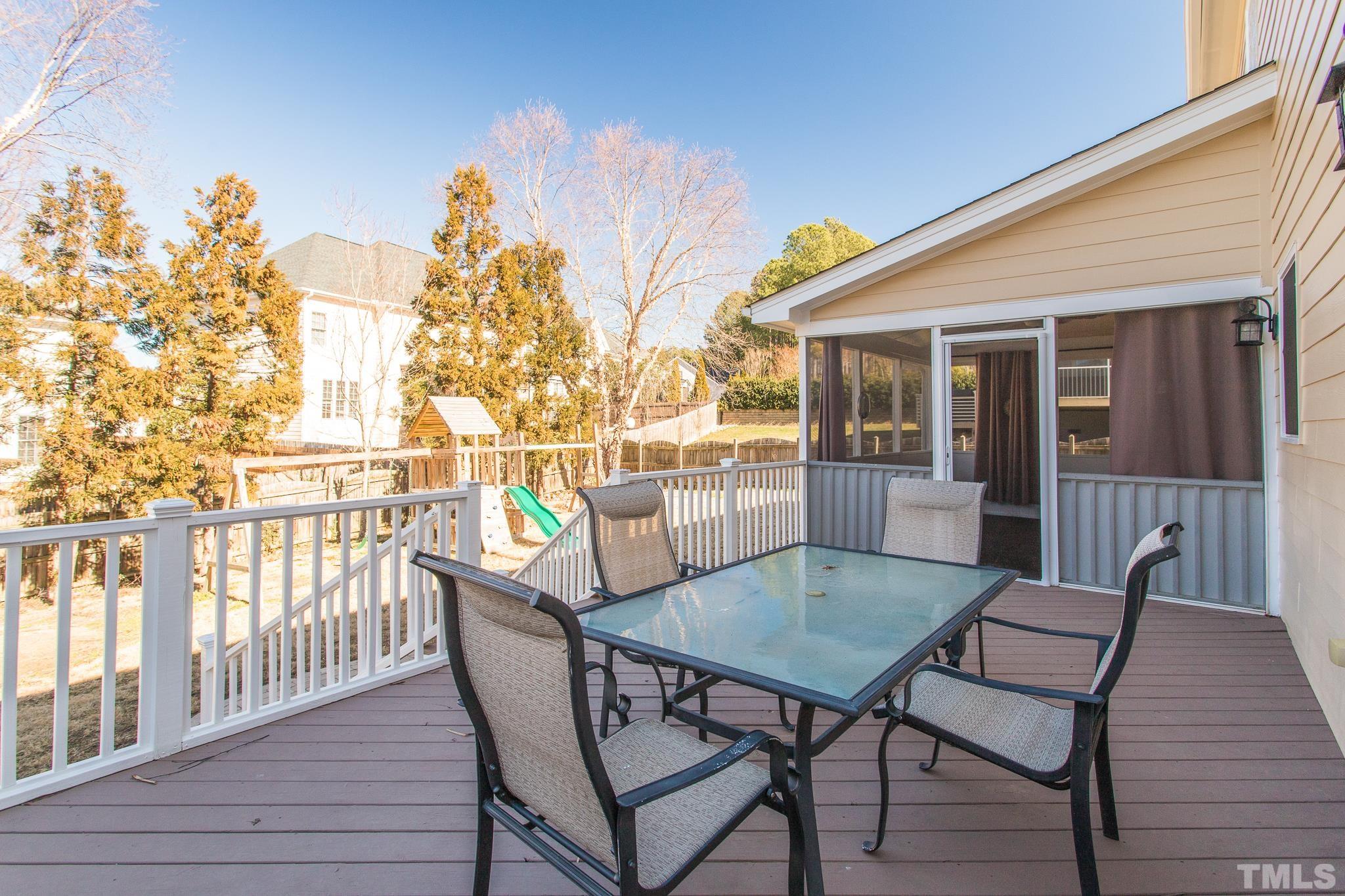 6023 Clapton Drive Wake Forest, NC 27587 - Photo 18 of 35 a view of a chairs and table on the deck