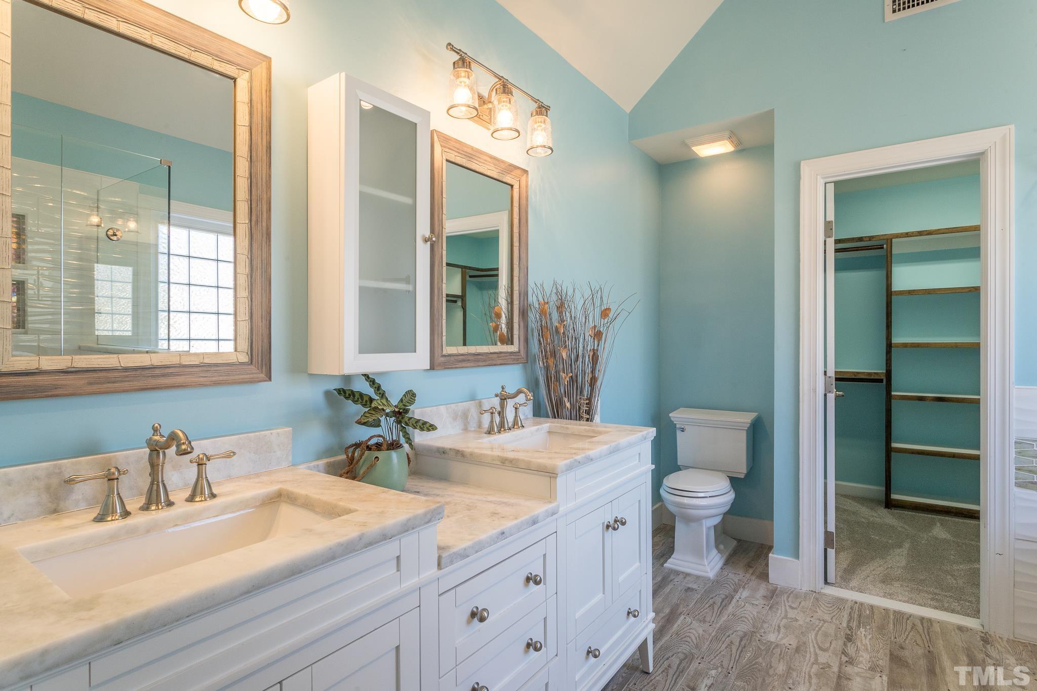 6023 Clapton Drive Wake Forest, NC 27587 - Photo 25 of 35 a bathroom with a granite countertop sink mirror vanity and toilet
