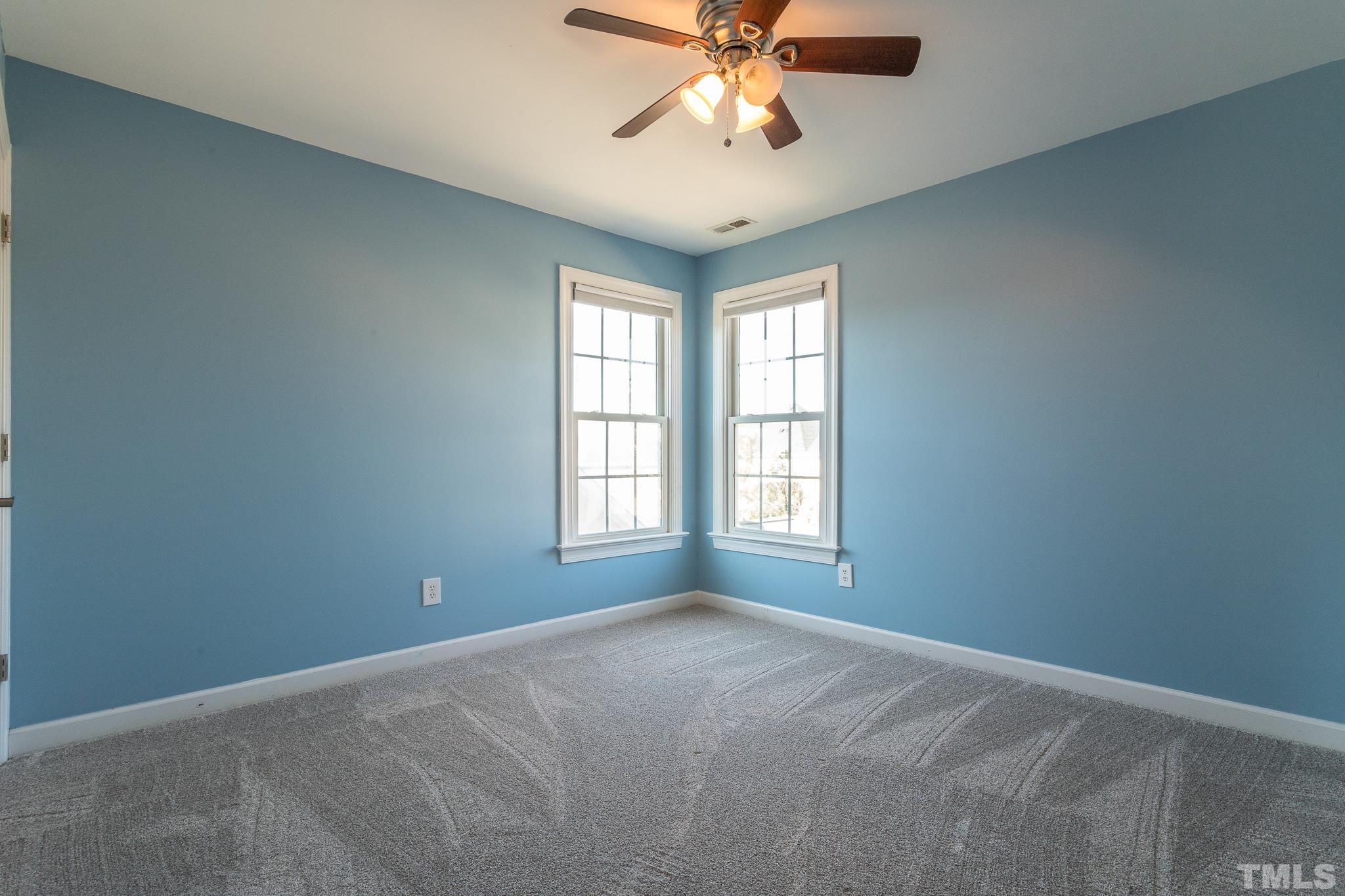 6023 Clapton Drive Wake Forest, NC 27587 - Photo 29 of 35 an empty room with windows and fan