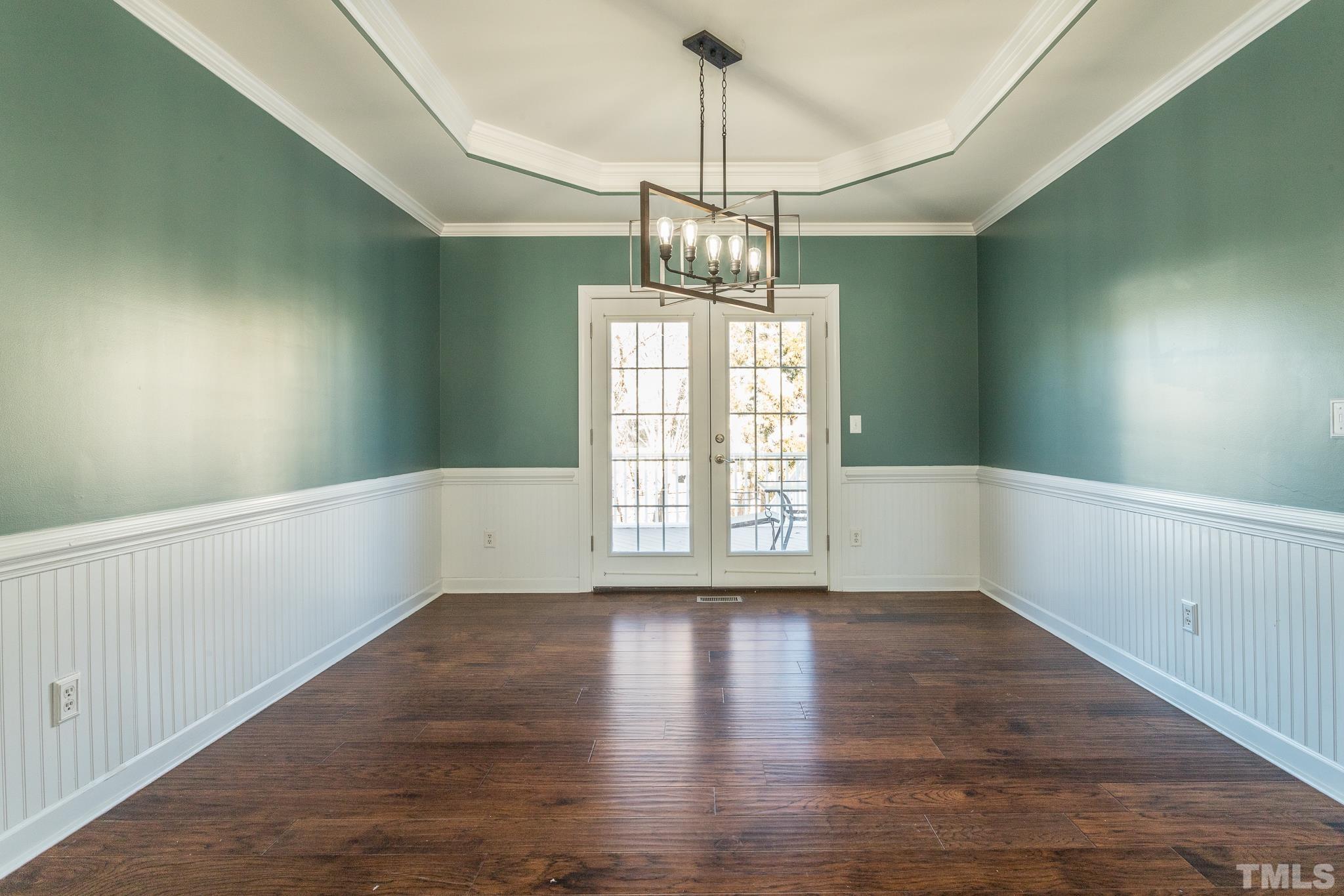 6023 Clapton Drive Wake Forest, NC 27587 - Photo 5 of 35 a view of an empty room with wooden floor and a window