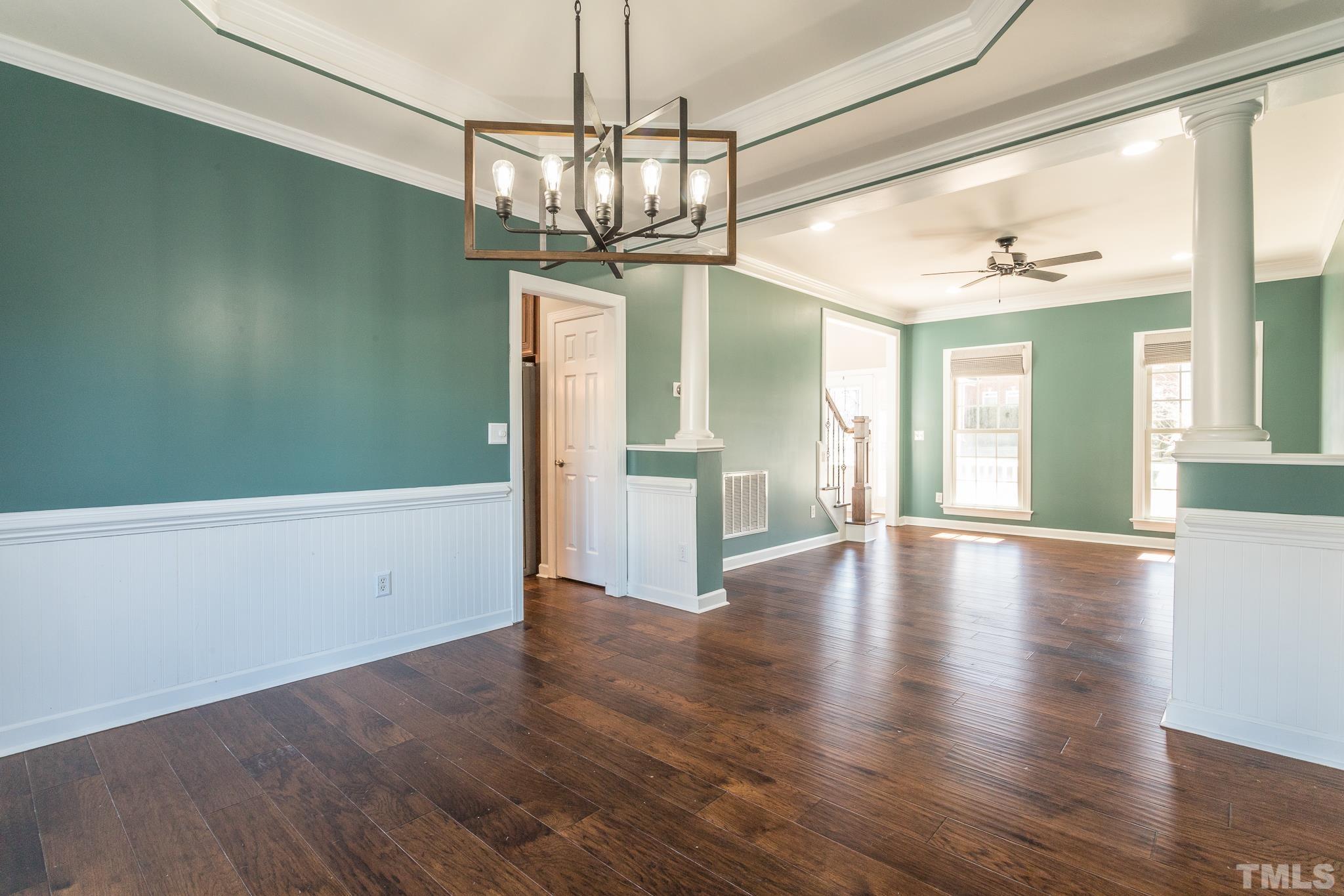 6023 Clapton Drive Wake Forest, NC 27587 - Photo 6 of 35 a view of a room with wooden floor ceiling fan and windows