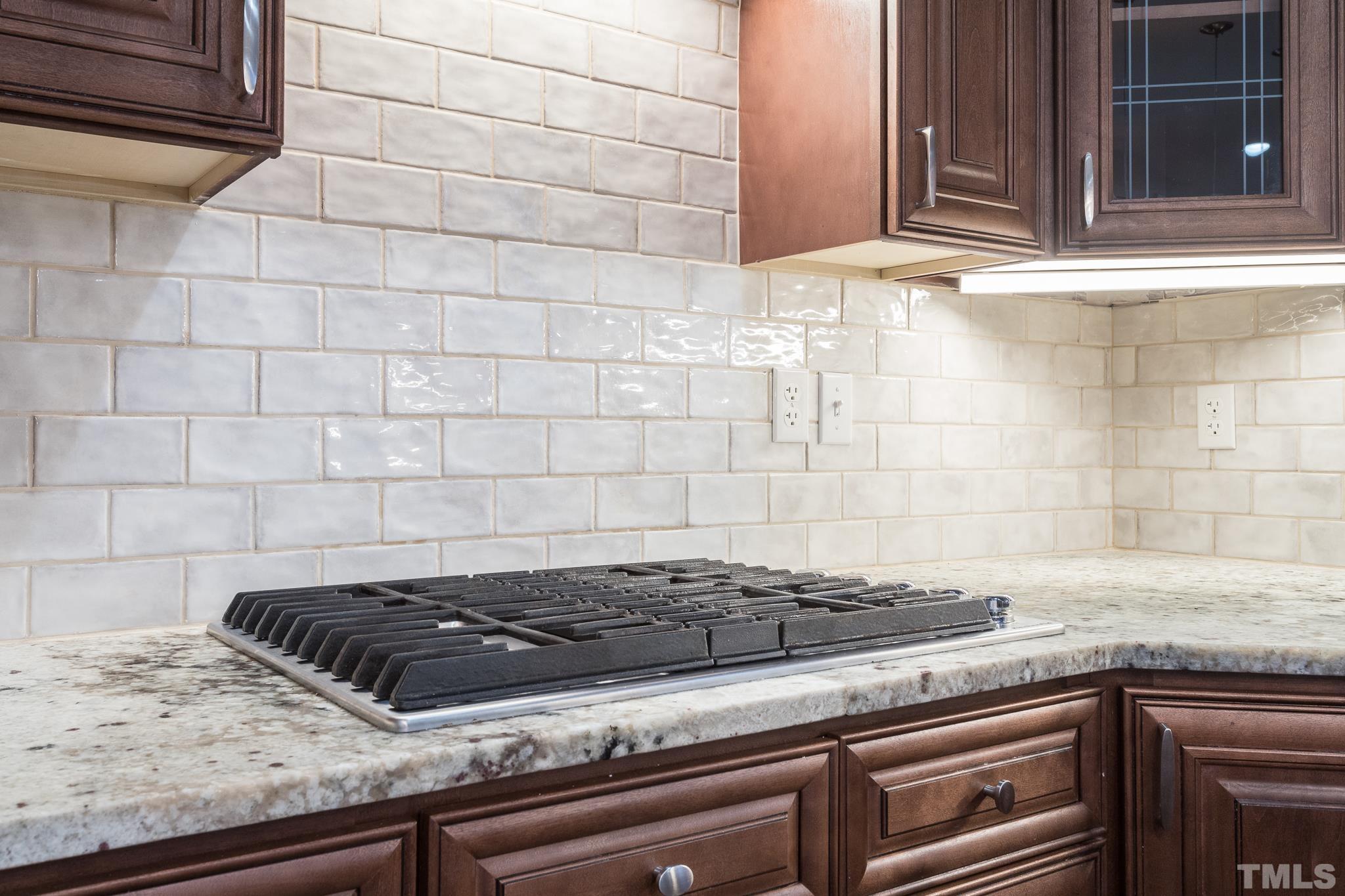 6023 Clapton Drive Wake Forest, NC 27587 - Photo 10 of 35 a stove top oven sitting inside of a kitchen