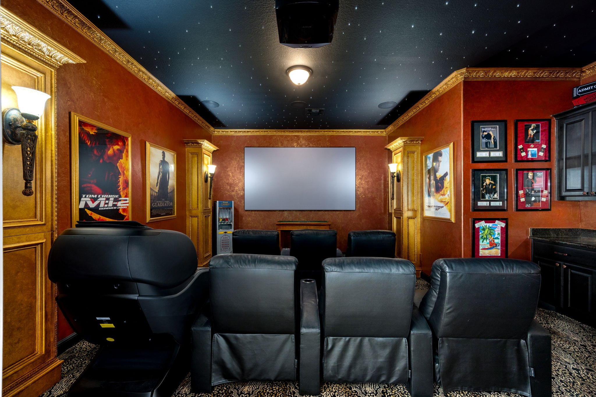 26515 Ashley Ridge Lane Katy, TX 77494 - Photo 36 of 50 Private theater room showcases ornate molding, rich wall and ceiling tones, and an intimate ambiance designed for an exceptional cinematic experience.