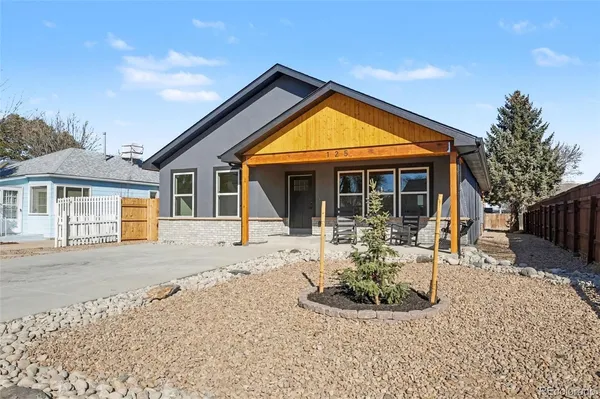 a view of a house with patio and wooden floor