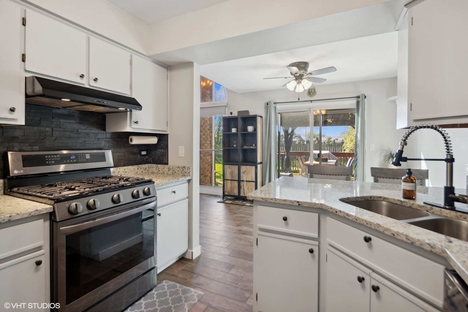 449 Wenbriar Square Addison, IL 60101 - Photo 10 of 35 a kitchen with granite countertop a stove and a sink