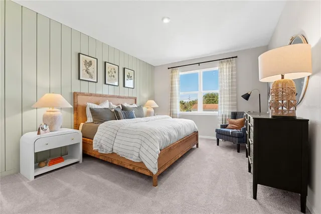 a spacious bedroom with a bed and a couch