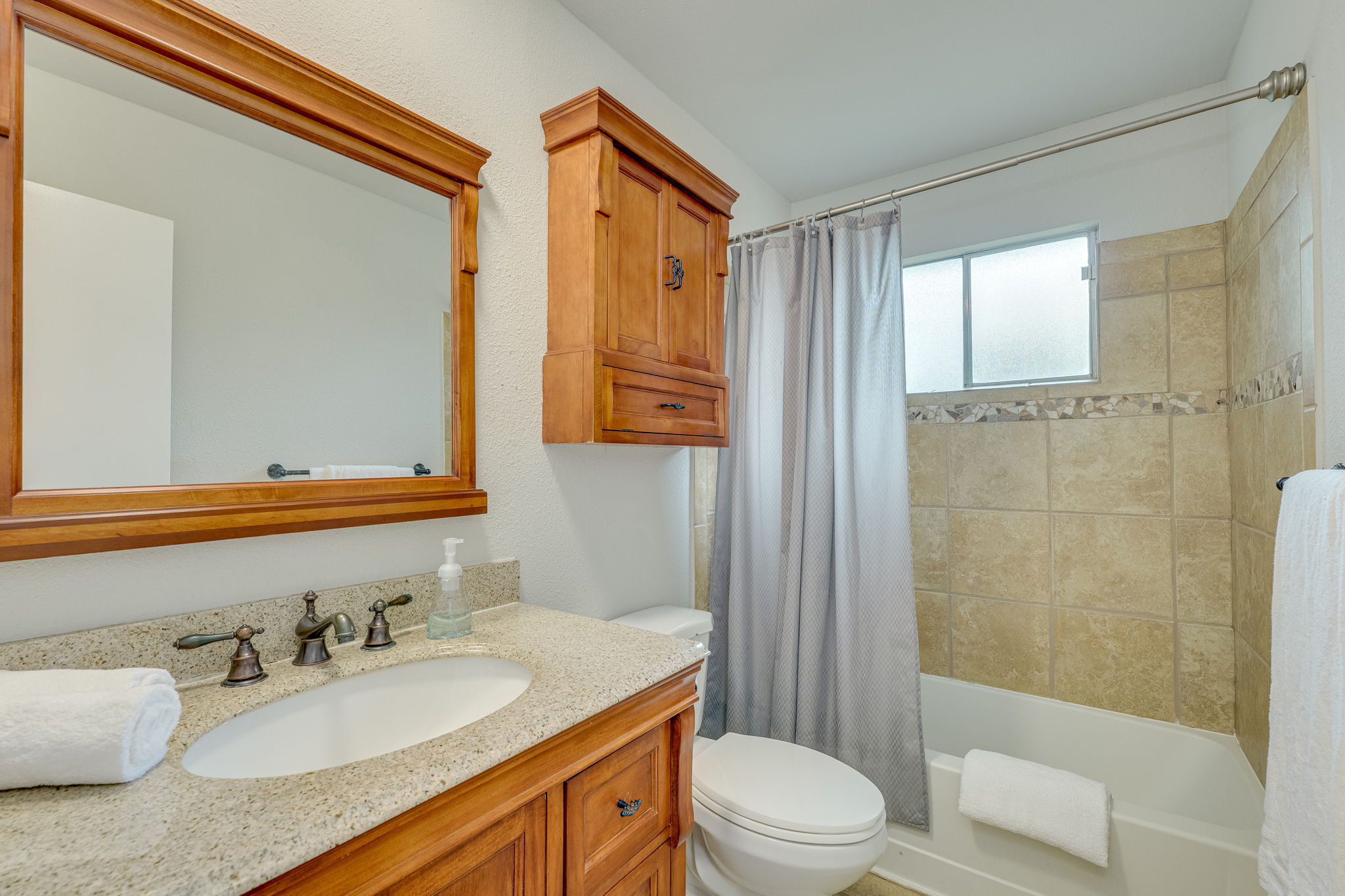 4815 Transit Circle Austin, TX 78727 - Photo 20 of 35 The secondary bathroom is conveniently situated between the two bedrooms, offering easy access from both.