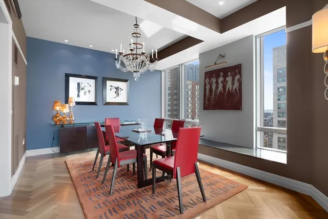 a view of a dining room with furniture and window