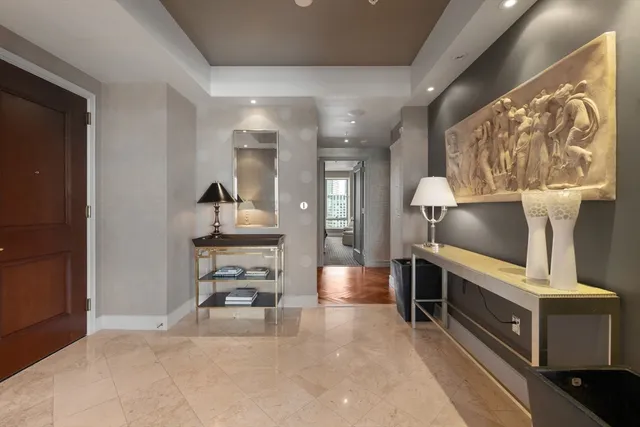 a bathroom with a sink toilet and mirror