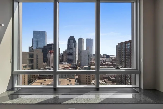 a bathroom with a tub sink and shower