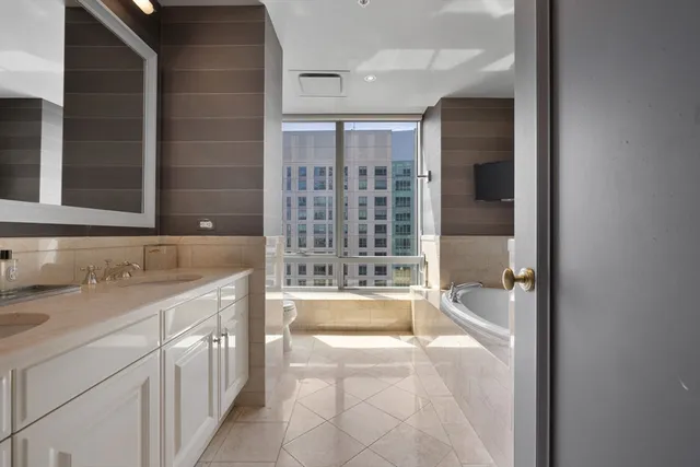 a bathroom with a sink and a large mirror