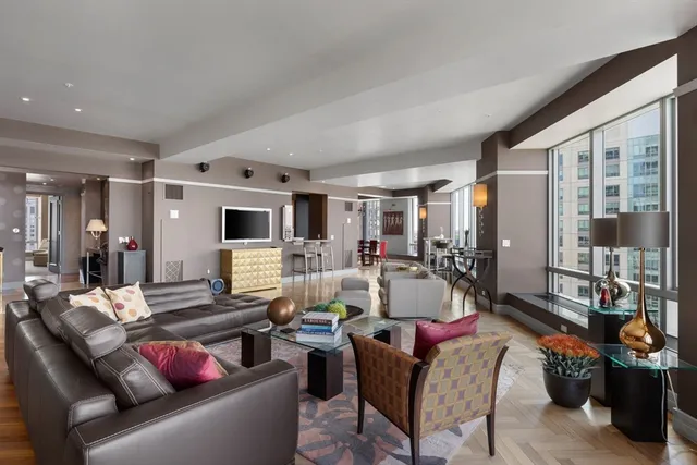 a living room with furniture and a table