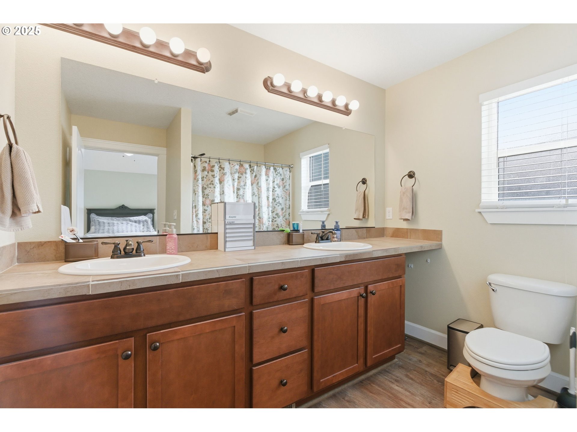 2726 Nina Place Hubbard, OR 97032 - Photo 12 of 21 a bathroom with a toilet a sink and mirror