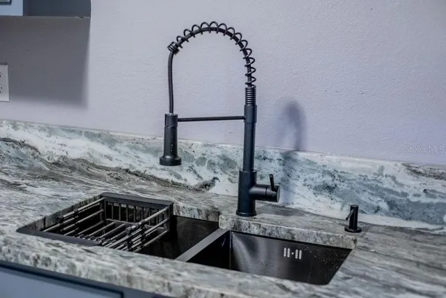 a kitchen with a sink and cabinets