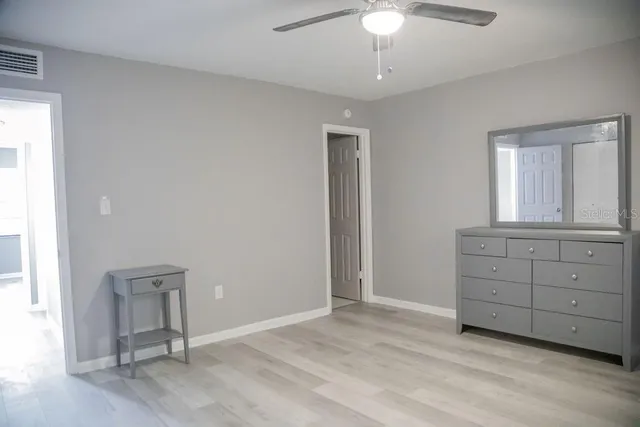 a view of an empty room with a window