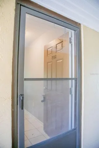 a bathroom with a glass shower door