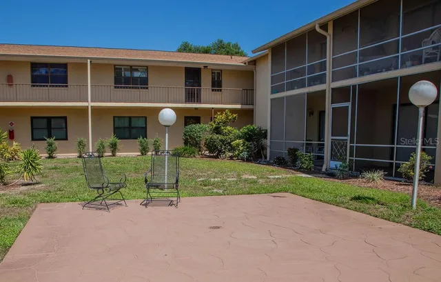a front view of a house with a yard and porch
