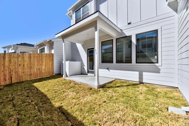 a view of house with backyard
