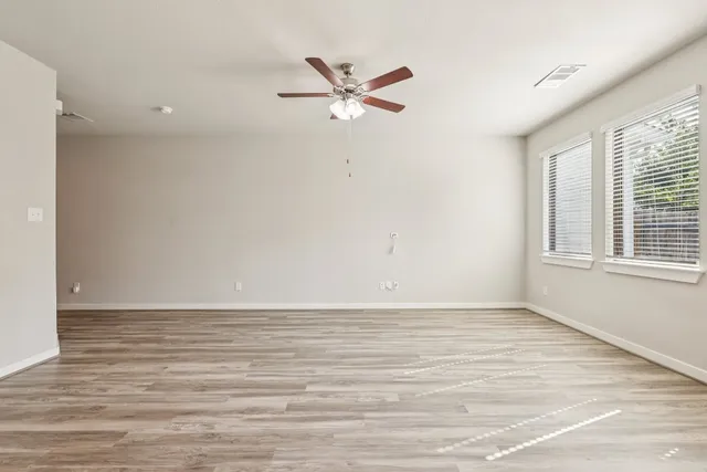 a kitchen with a sink and wooden cabinets