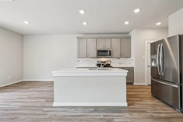 a bathroom with a sink a mirror and a toilet