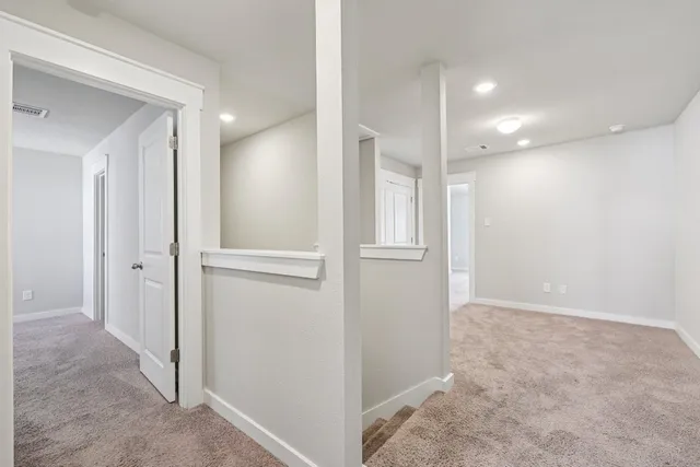 a spacious bathroom with a double vanity sink a mirror and a shower