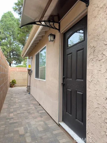 a view of a wooden door of the house