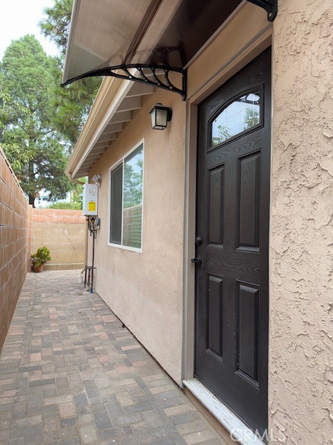 18419 Tuba Street Northridge, CA 91325 - Photo 3 of 15 a view of a wooden door of the house