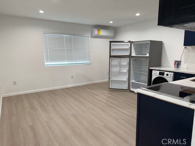 18419 Tuba Street Northridge, CA 91325 - Photo 5 of 15 a kitchen with stainless steel appliances granite countertop a refrigerator and a stove top oven