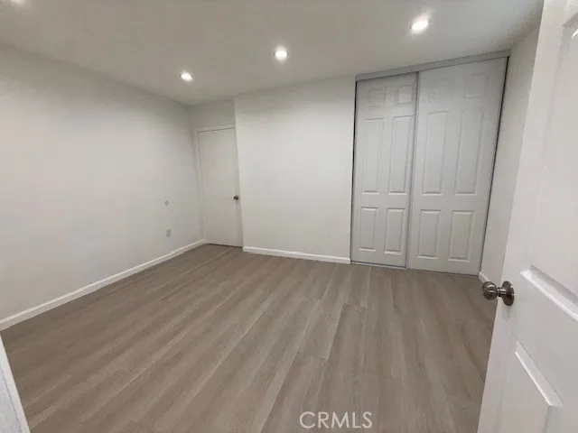 a view of a livingroom with wooden floor