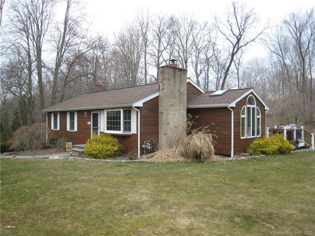 210 Fan Hill Road Monroe, CT 06468 - Photo 1 of 1 a front view of house with yard and trees in the background