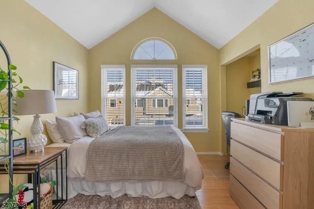 a view of staircase with white walls and railing