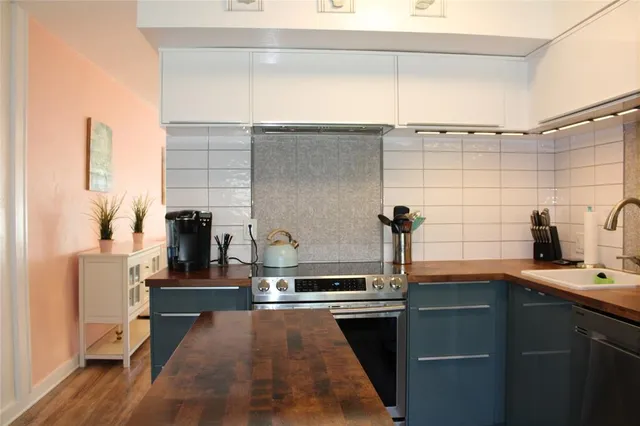a kitchen with a sink and appliances