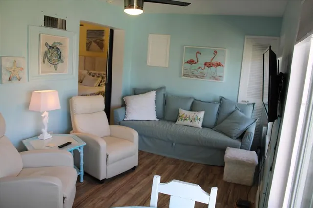 a bedroom with a bed and wall painting