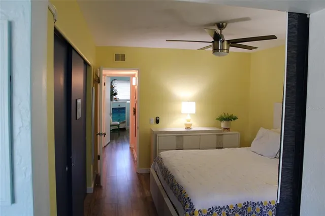 a bedroom with a bed and a window