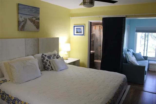 a bedroom with a bed and a dresser