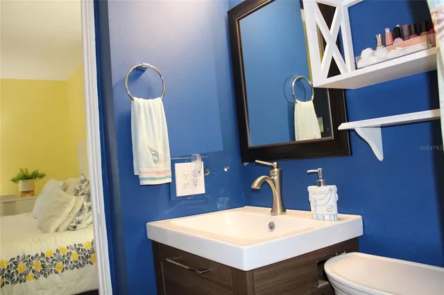 a bathroom with a sink and toilet