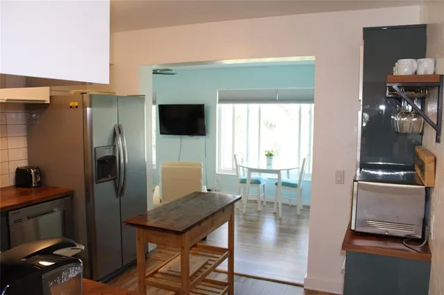 a kitchen with a stove and a microwave