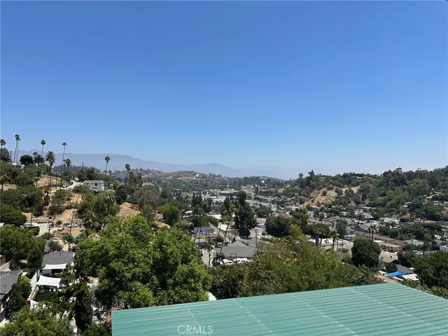 an aerial view of residential house and green space