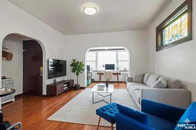 a living room with furniture fireplace and a flat screen tv