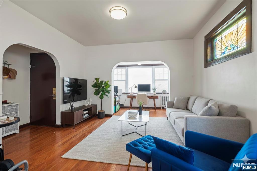 a living room with furniture fireplace and a flat screen tv
