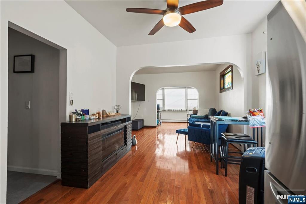 436 Undercliff Avenue, Unit 1 Edgewater, NJ 07020 - Photo 11 of 16 a living room with furniture and wooden floor