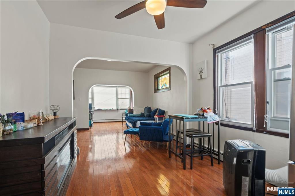 436 Undercliff Avenue, Unit 1 Edgewater, NJ 07020 - Photo 4 of 16 a living room with furniture and a large window