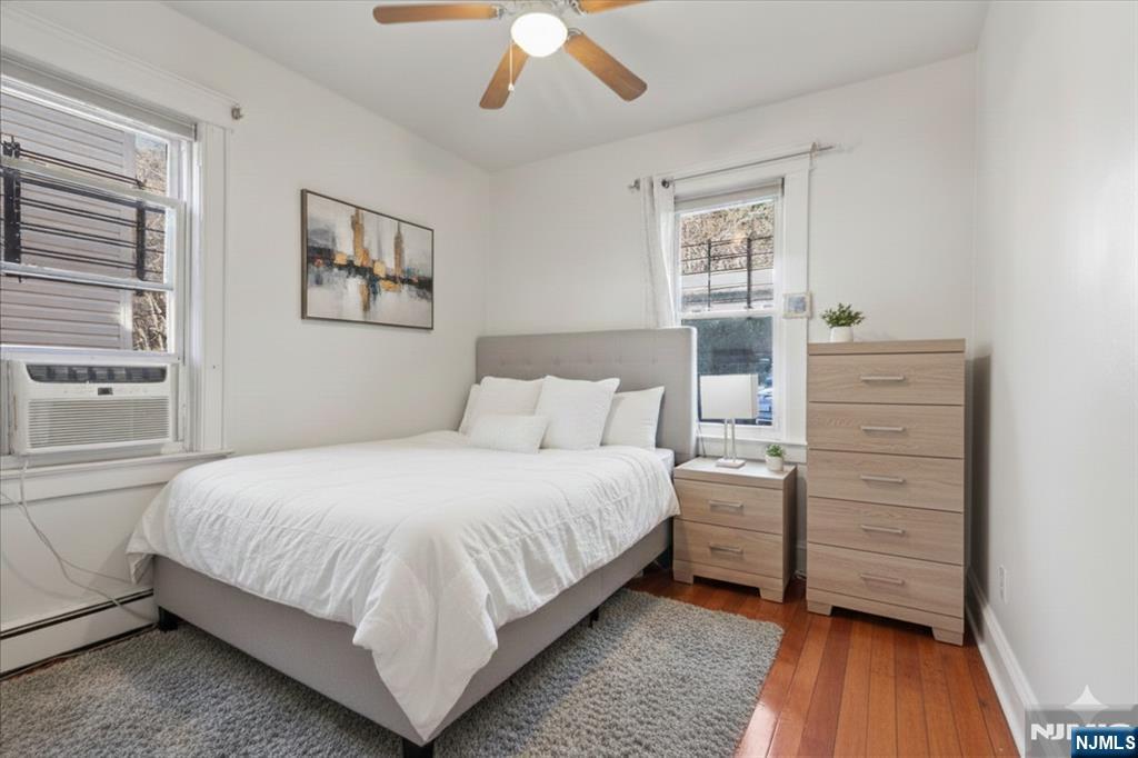 436 Undercliff Avenue, Unit 1 Edgewater, NJ 07020 - Photo 5 of 16 a bedroom with a bed and a window