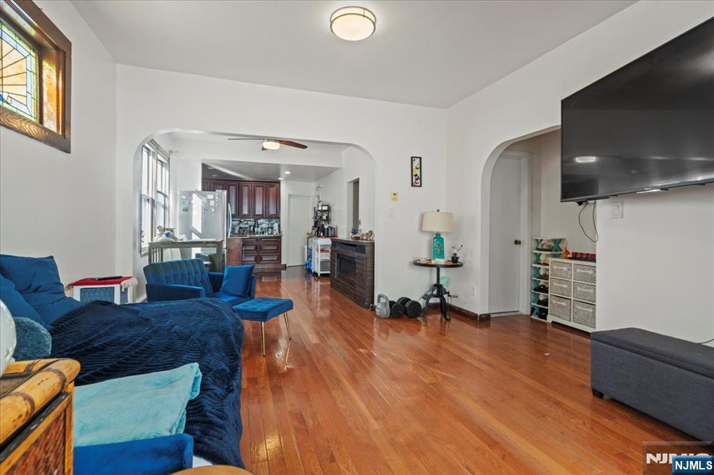 436 Undercliff Avenue, Unit 1 Edgewater, NJ 07020 - Photo 9 of 16 a living room with furniture and a flat screen tv